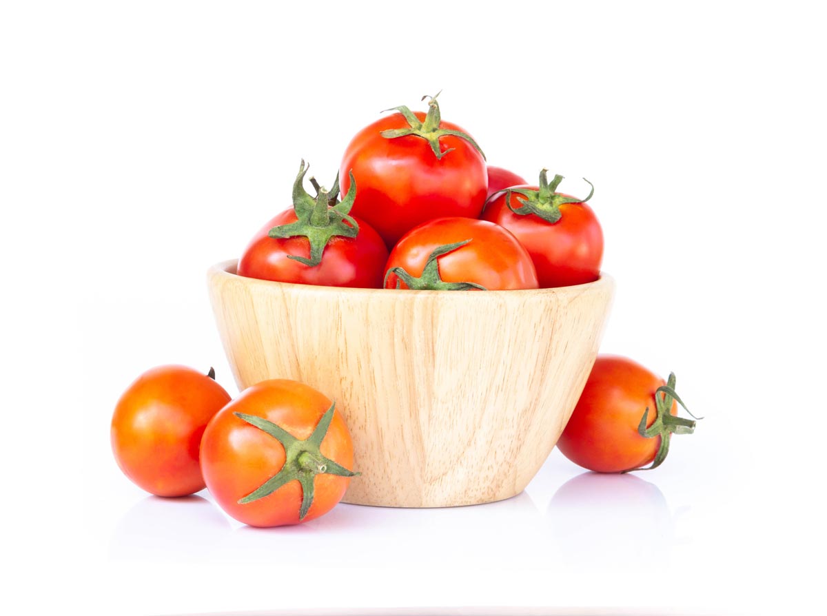 red cherry tomatoes in red bowl