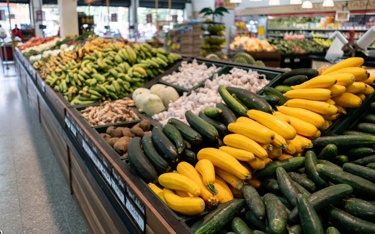 Summer squash in the produce section of grocery store