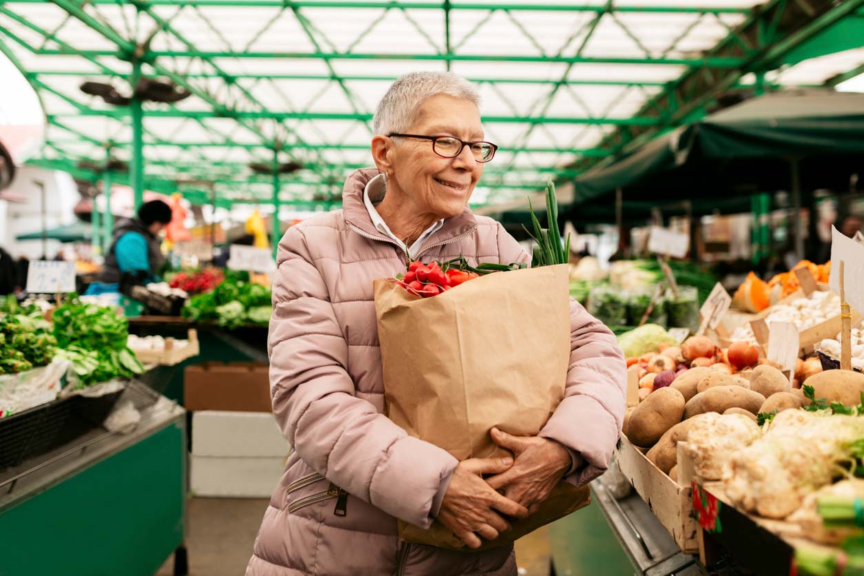 elderly person shopping at farmers market