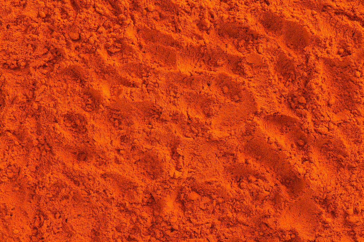 full frame of red ground paprika background