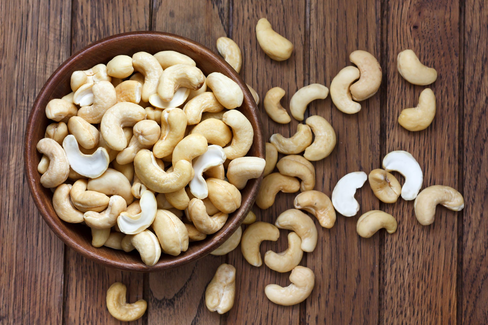 cashews in a bowl and on the table