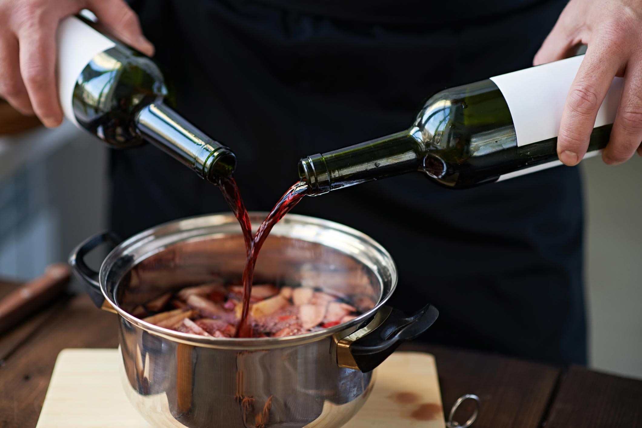 pouring wine into pot