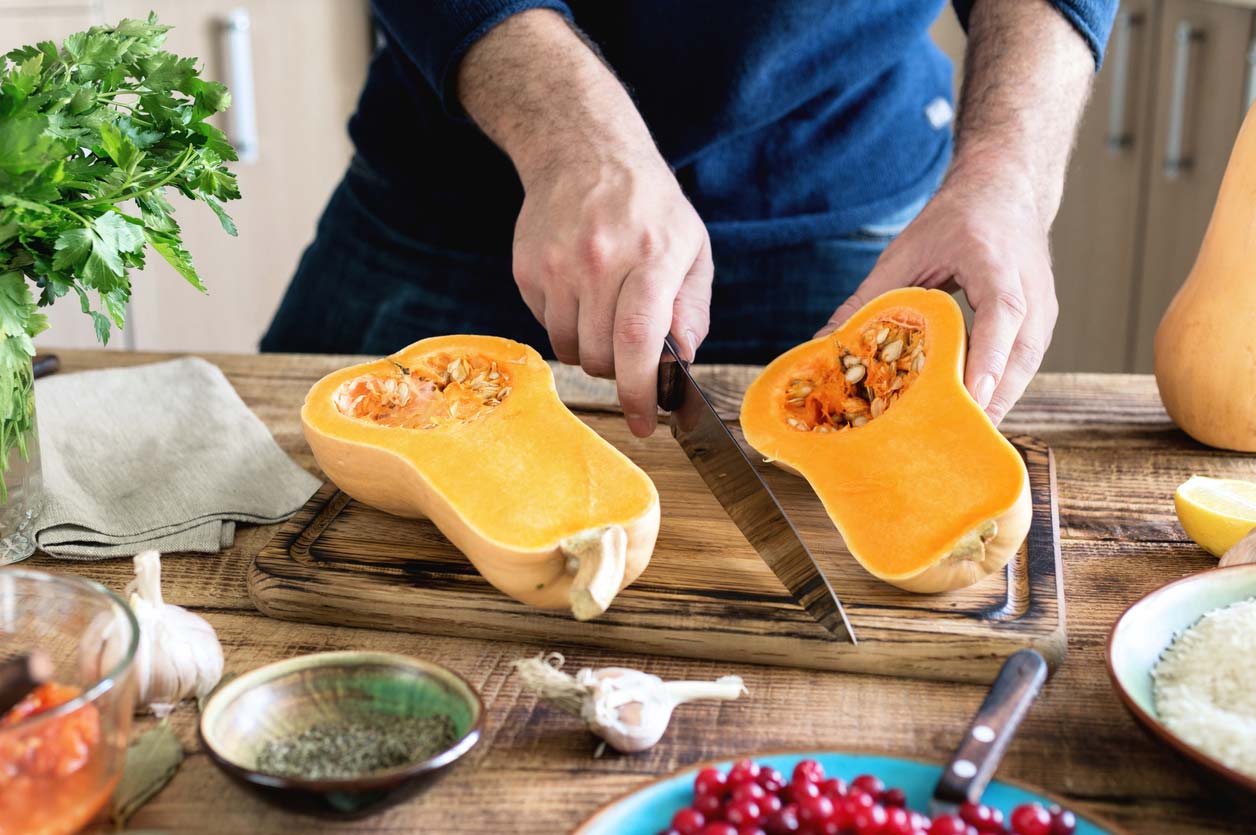 Cutting butternut squash, which is full of health benefits