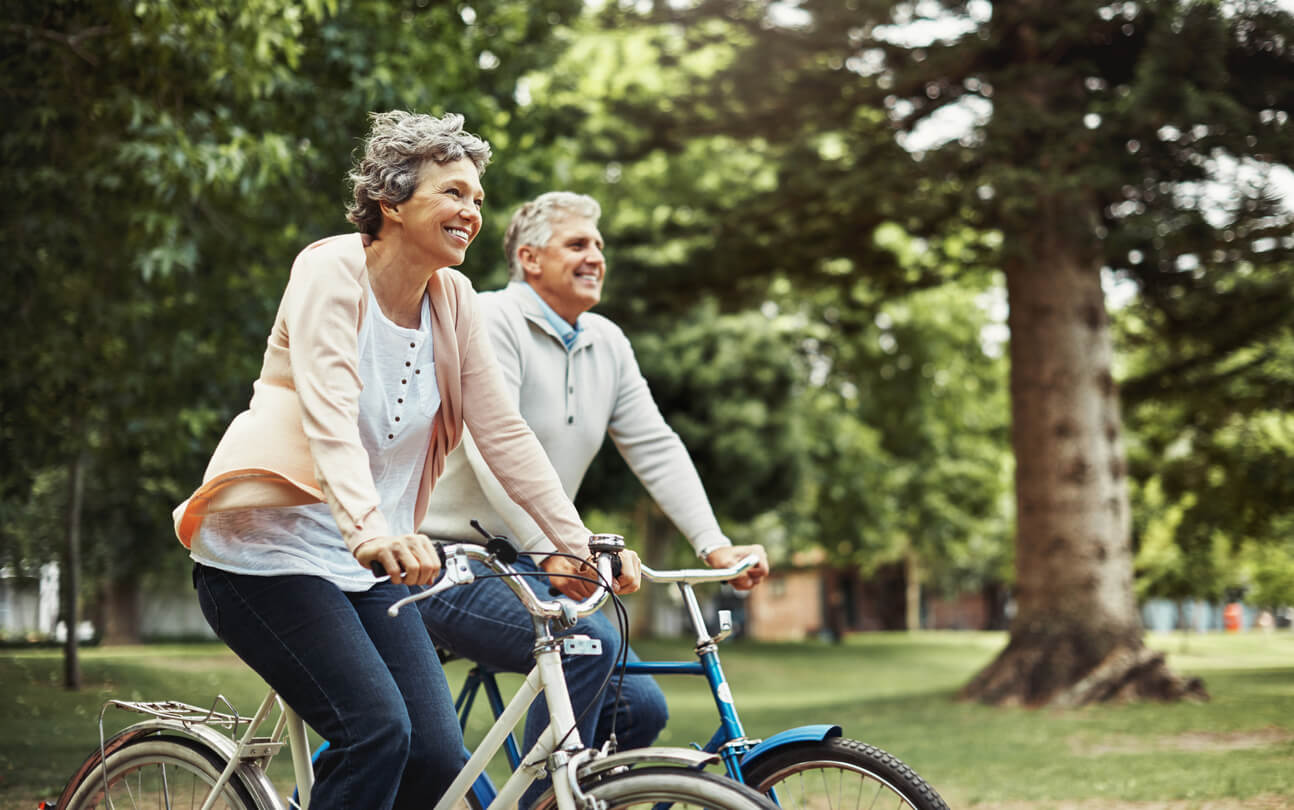 mature couple enjoying a bike ride together