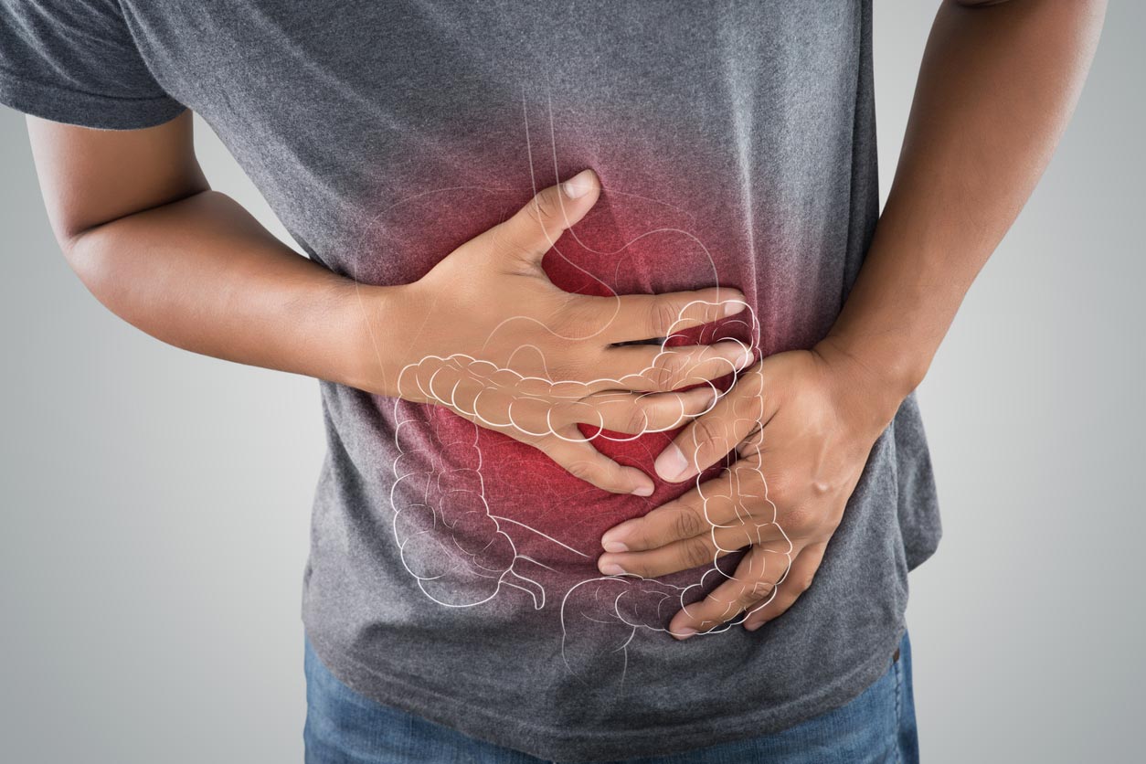 intestine graphic overlaid on stomach of man